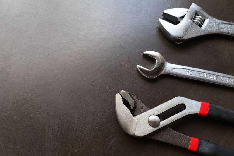 Wrenches and adjustable pliers used for plumbing repairs
